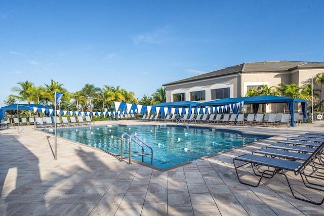 view of swimming pool featuring a patio area