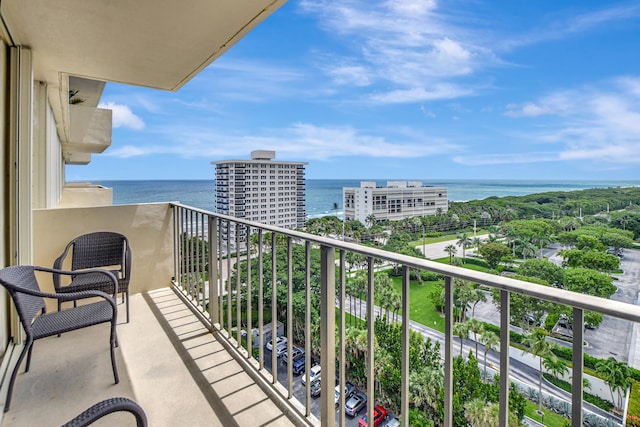 balcony featuring a water view