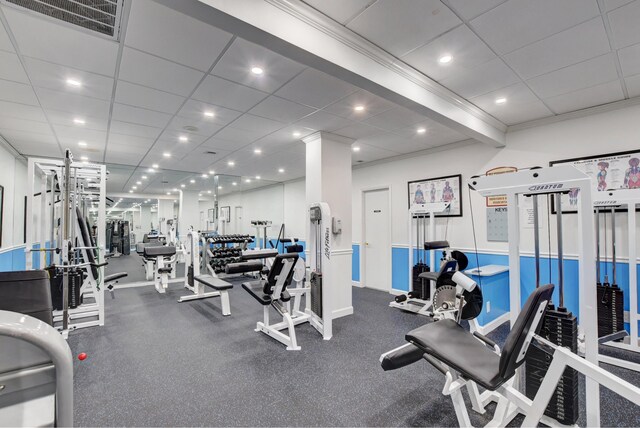 workout area featuring a drop ceiling