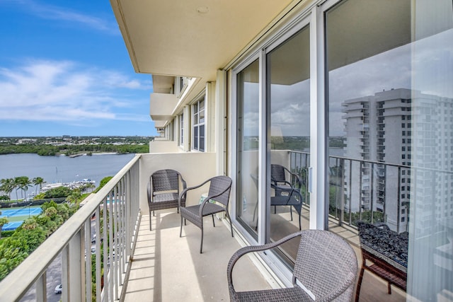 balcony featuring a water view