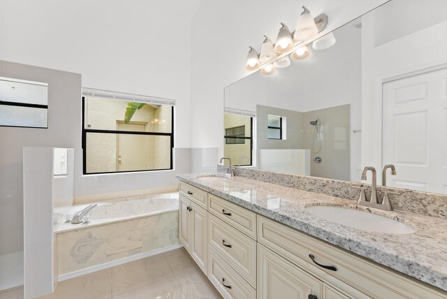 bathroom with vanity and plus walk in shower