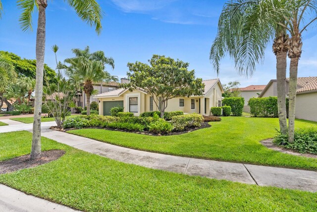 mediterranean / spanish house featuring a front yard