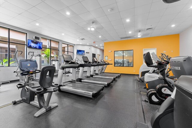 workout area with a drop ceiling