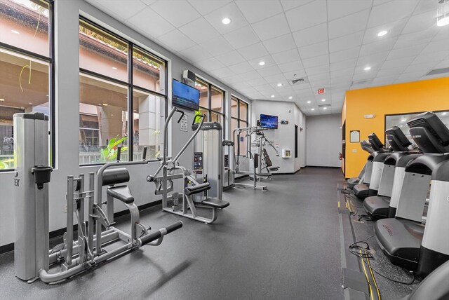 workout area with a drop ceiling