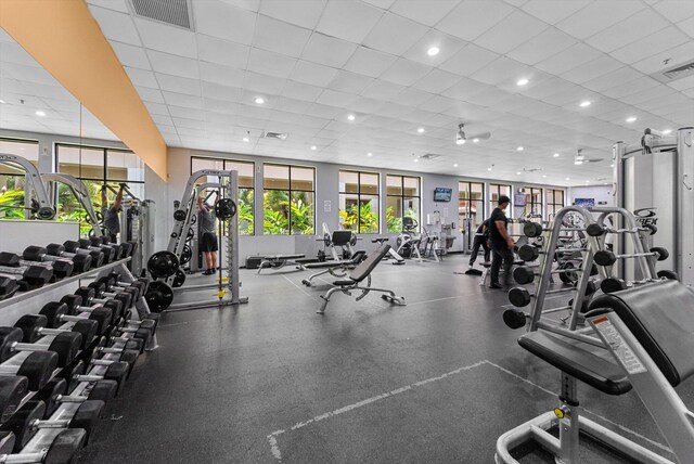 gym featuring a drop ceiling