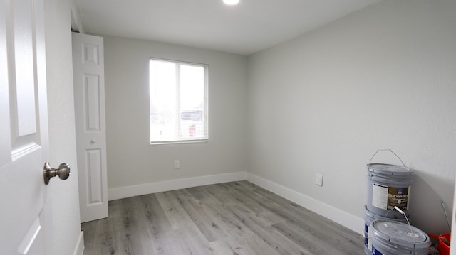 spare room featuring light hardwood / wood-style flooring