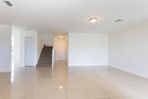 unfurnished room featuring light tile patterned flooring