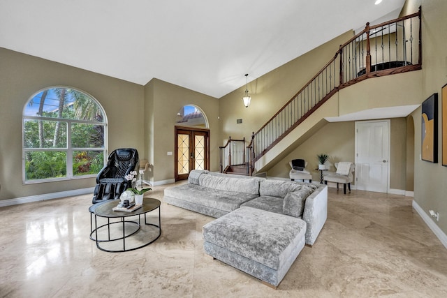 living room with a towering ceiling