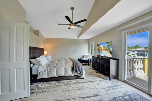 bedroom with vaulted ceiling, access to exterior, and ceiling fan