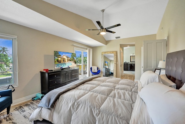 bedroom featuring lofted ceiling, multiple windows, ceiling fan, and light hardwood / wood-style flooring