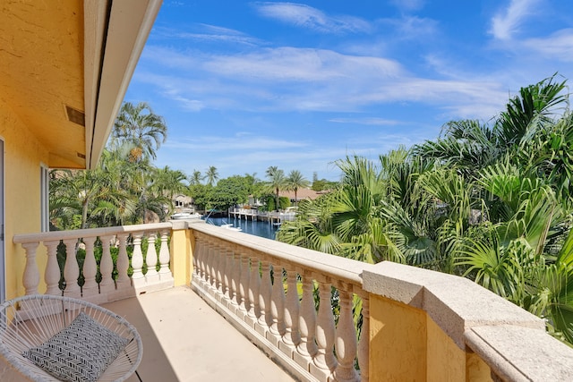 balcony featuring a water view