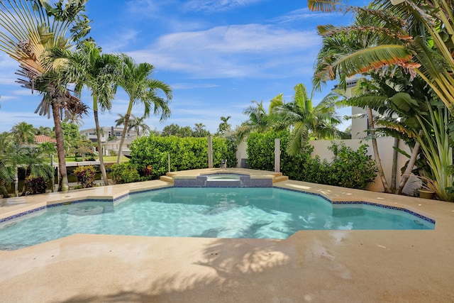 view of pool with an in ground hot tub