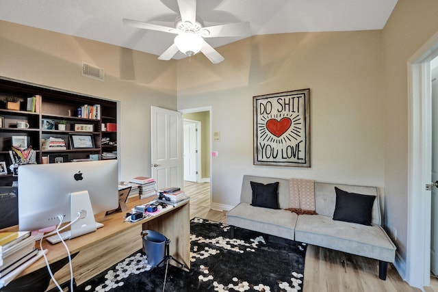 office featuring lofted ceiling, ceiling fan, and wood-type flooring