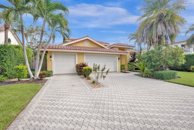 view of front of property with a garage