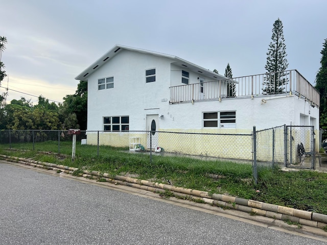 view of side of property featuring a balcony