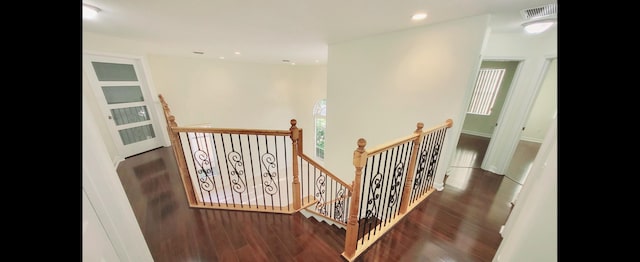 staircase with wood-type flooring