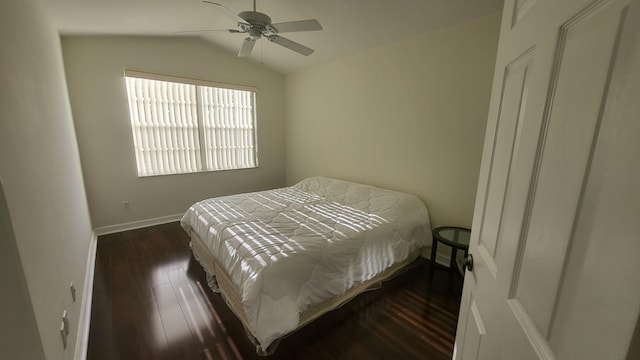 bedroom featuring lofted ceiling, ceiling fan, and dark hardwood / wood-style floors