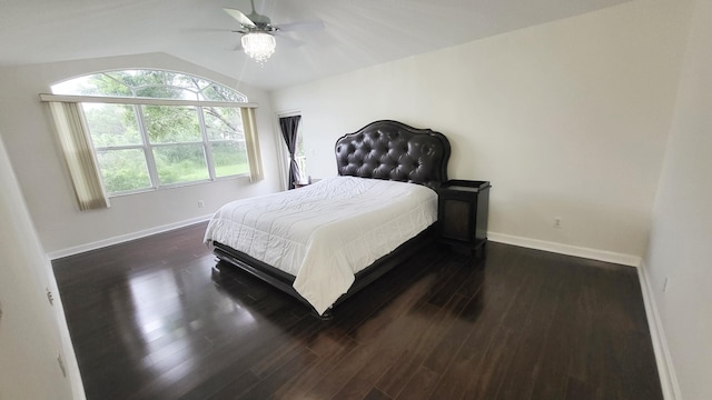 bedroom featuring ceiling fan, lofted ceiling, and dark hardwood / wood-style floors