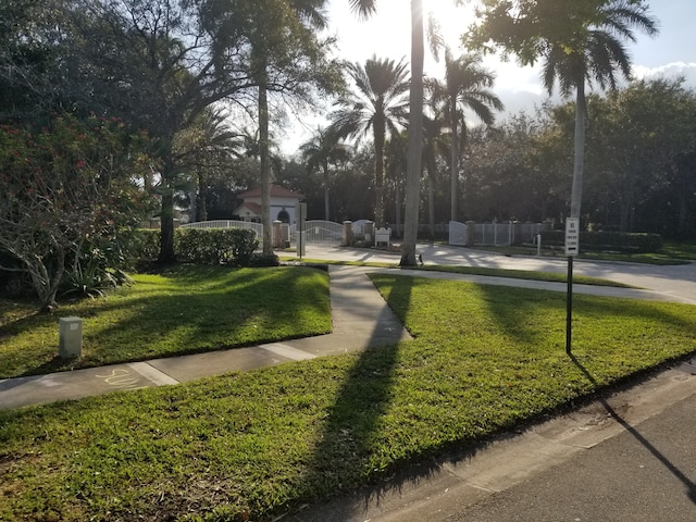 surrounding community featuring a yard and an outdoor structure