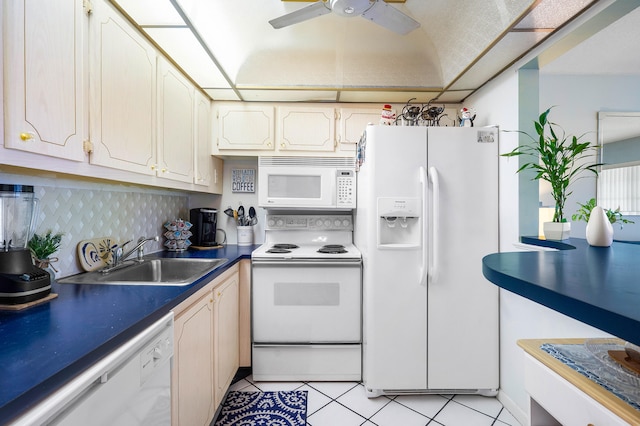 kitchen featuring ceiling fan, sink, white appliances, and light tile patterned flooring