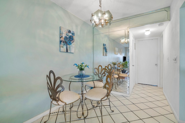 dining area featuring an inviting chandelier and light tile patterned flooring