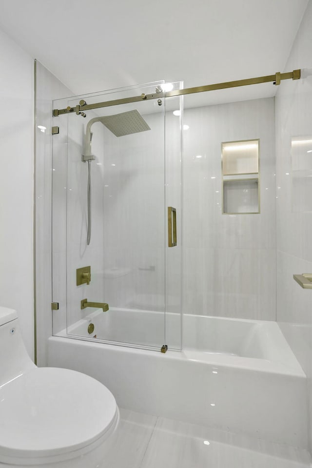 bathroom with enclosed tub / shower combo and toilet