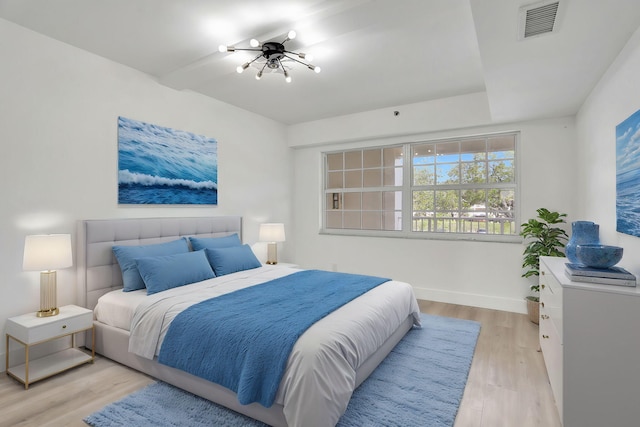 bedroom with light hardwood / wood-style floors