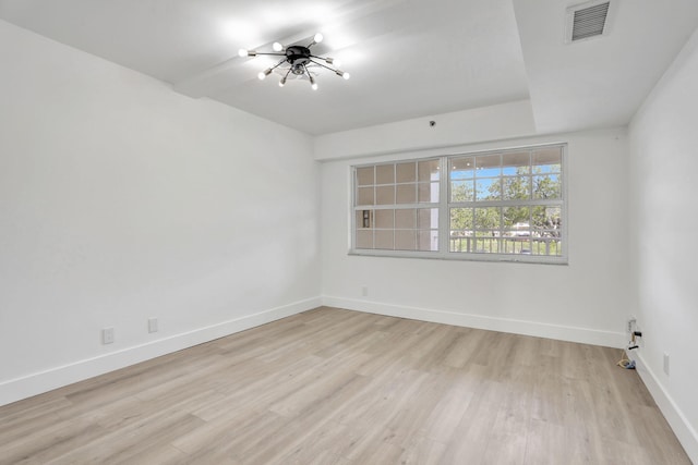 spare room with light wood-type flooring