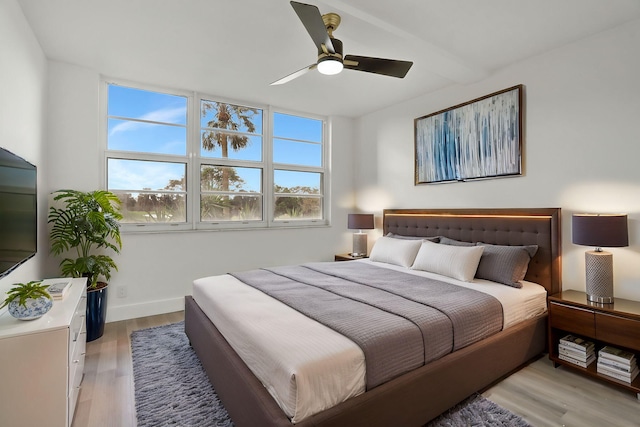 bedroom featuring ceiling fan and light hardwood / wood-style flooring