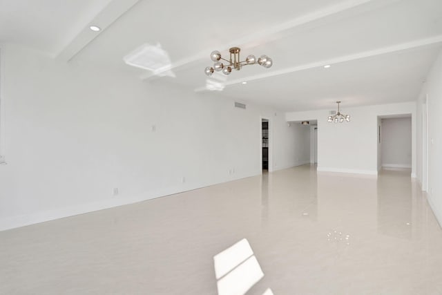 tiled empty room featuring a notable chandelier and beam ceiling