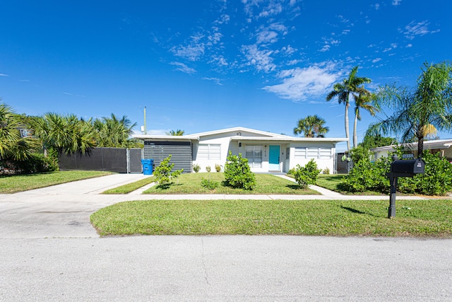 ranch-style house with a front lawn