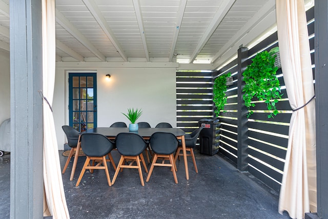 dining space featuring concrete floors