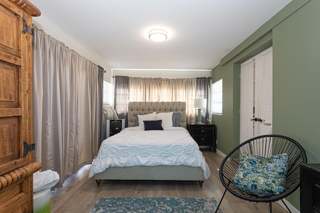 bedroom with wood-type flooring