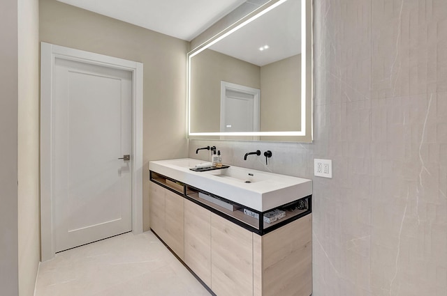 bathroom with tile patterned flooring and vanity