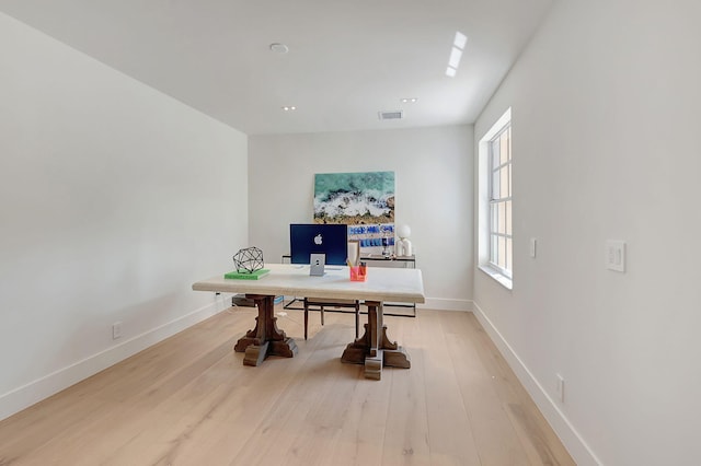 office space with light hardwood / wood-style flooring