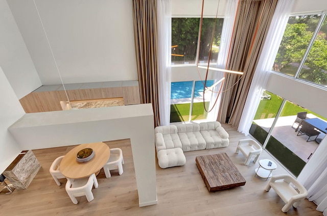 living area with hardwood / wood-style flooring