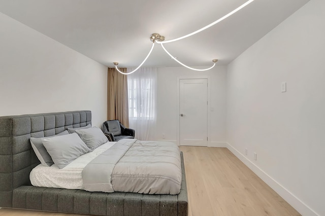 bedroom with light hardwood / wood-style floors