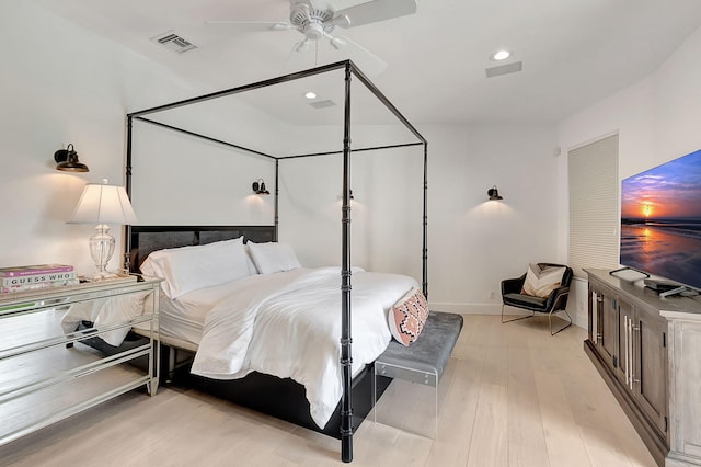 bedroom with ceiling fan and light hardwood / wood-style flooring