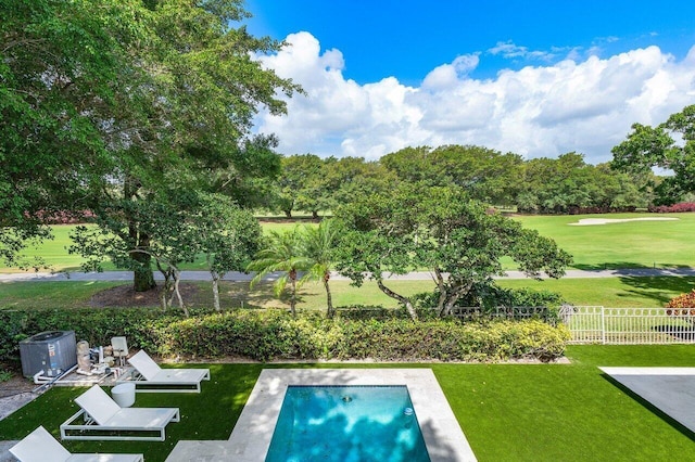 view of pool featuring a yard