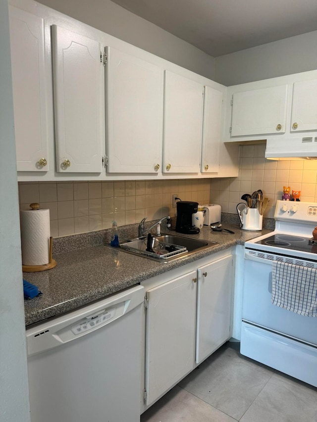 kitchen with decorative backsplash, white cabinets, white appliances, and sink