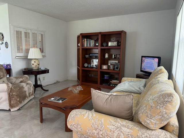 living room with a wealth of natural light and a textured ceiling