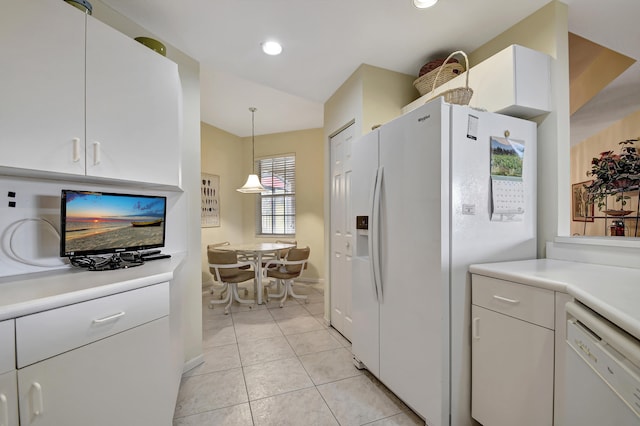 kitchen featuring white cabinetry, white appliances, light tile patterned floors, and hanging light fixtures