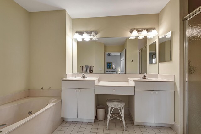 bathroom featuring vanity, independent shower and bath, and tile patterned floors