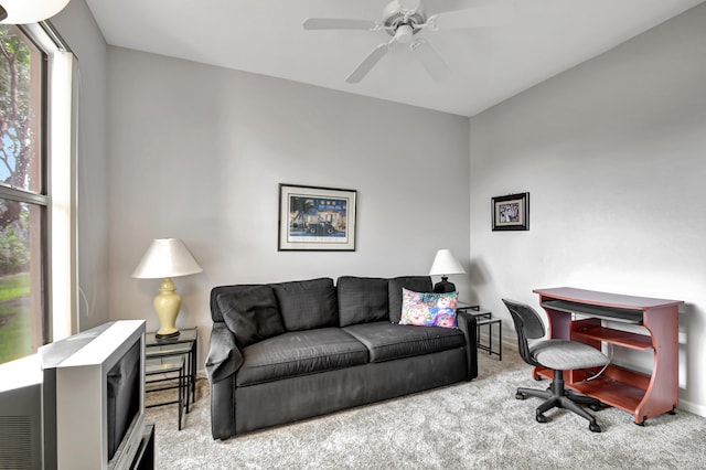 living room featuring ceiling fan and light colored carpet