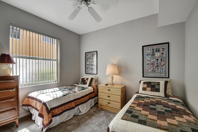 bedroom featuring ceiling fan and carpet