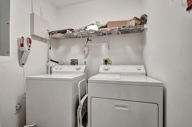 clothes washing area featuring independent washer and dryer