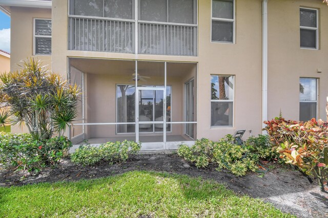 back of property featuring a balcony