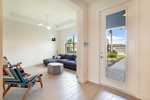 foyer with a raised ceiling