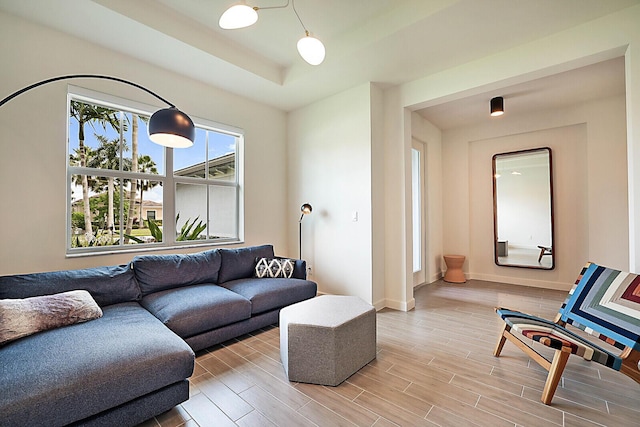 living room with a tray ceiling