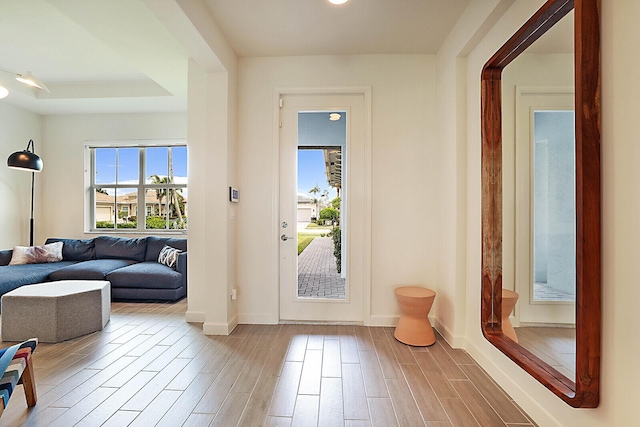 doorway with a tray ceiling